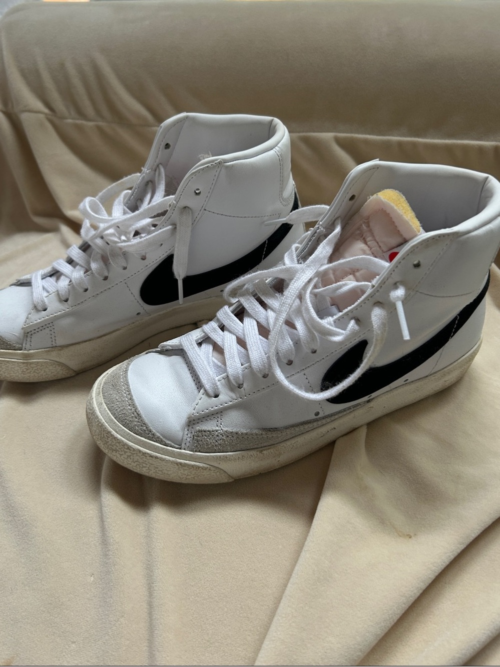 Nike White High-Top Sneakers with Black Swoosh